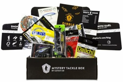 A variety of fishing gear and lures from Mystery Tackle Box displayed.